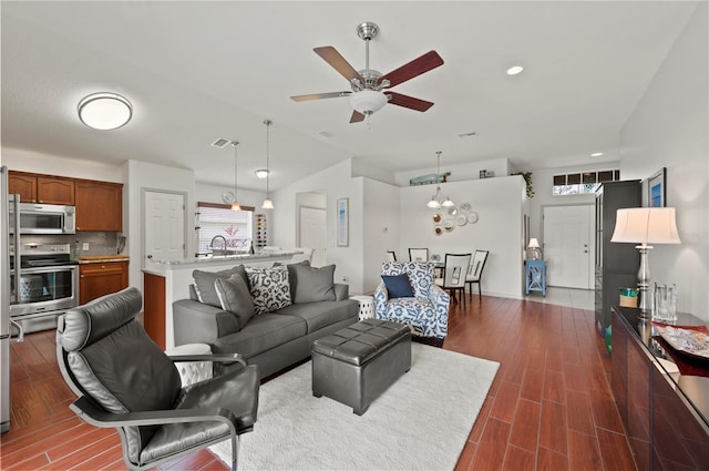 living room with lofted ceiling and ceiling fan