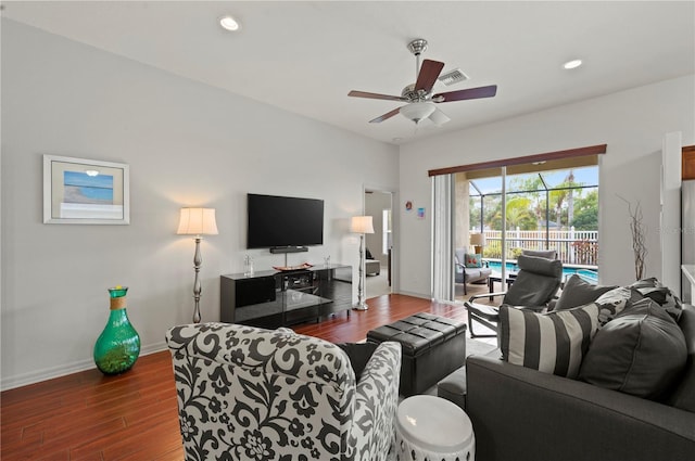 living room featuring dark hardwood / wood-style floors and ceiling fan