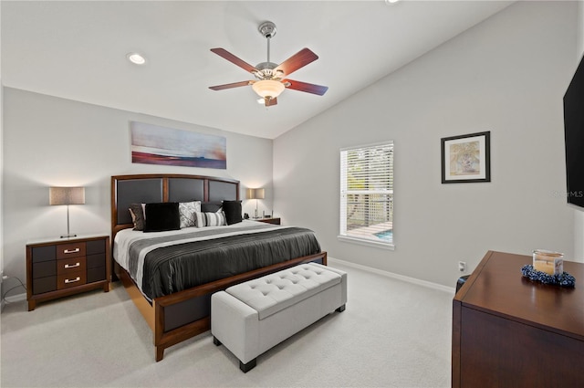 carpeted bedroom with ceiling fan and lofted ceiling