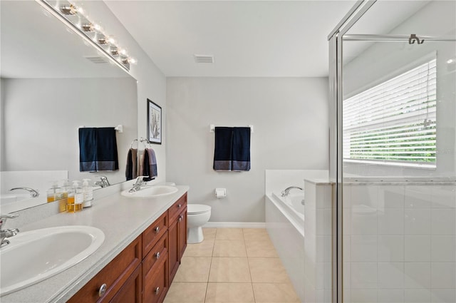 full bathroom with vanity, toilet, tile patterned flooring, and plus walk in shower