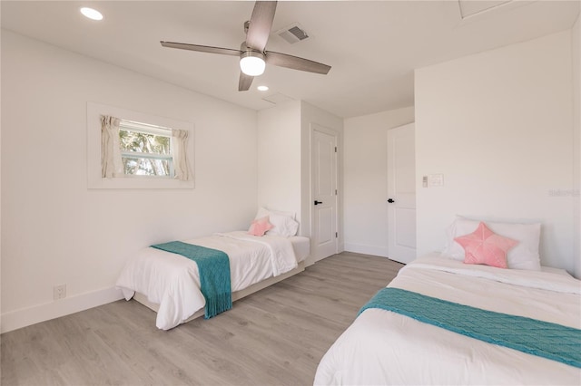 bedroom featuring light wood-type flooring and ceiling fan