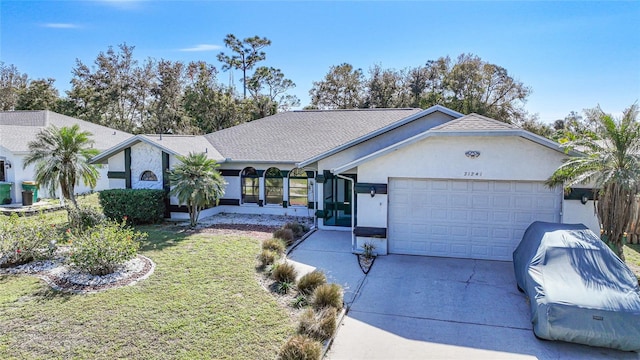 ranch-style house with a front yard and a garage