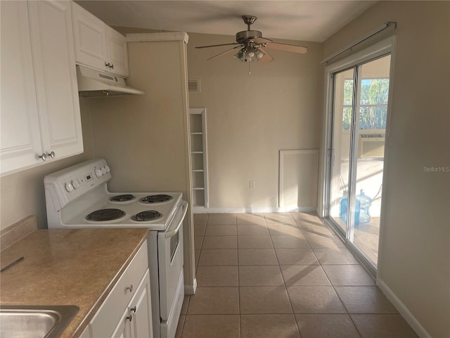 kitchen featuring electric range, sink, ceiling fan, light tile patterned floors, and white cabinets