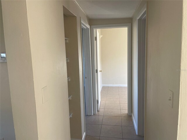 hallway with light tile patterned floors