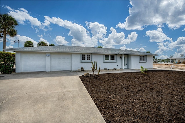 single story home featuring a garage