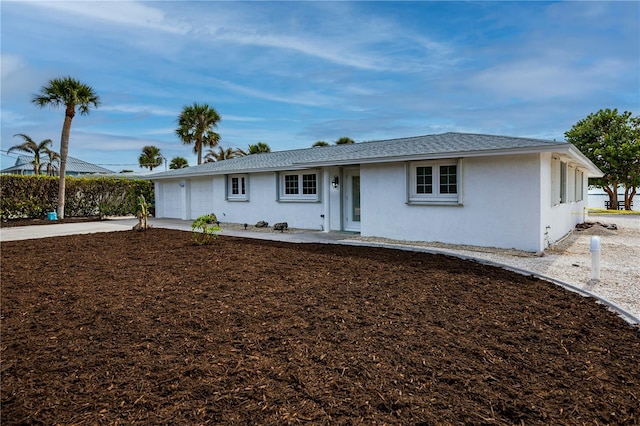 ranch-style home with a garage