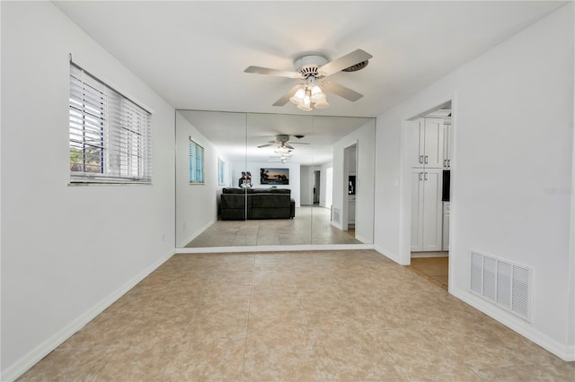 hallway featuring light tile patterned flooring