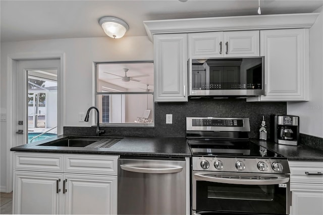 kitchen with ceiling fan, sink, white cabinetry, and appliances with stainless steel finishes