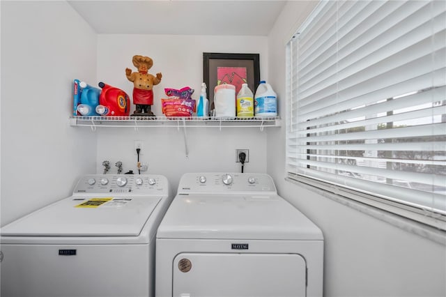 laundry room featuring washing machine and clothes dryer