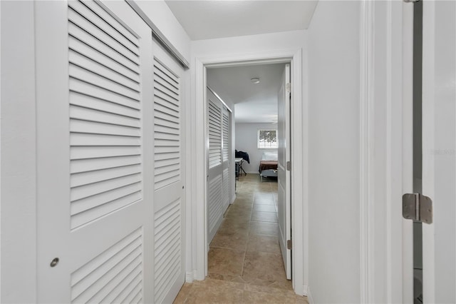 hallway with light tile patterned floors