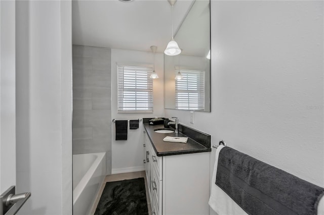 bathroom featuring tile patterned flooring and vanity