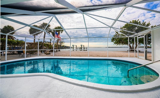 view of pool featuring a patio area and glass enclosure