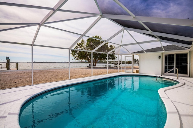 view of swimming pool featuring a patio area and glass enclosure