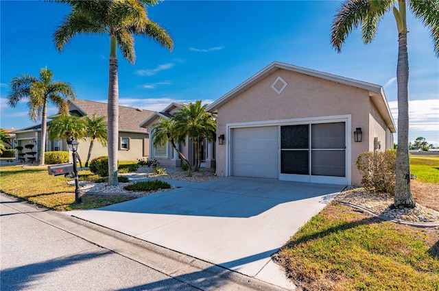 ranch-style home with a front lawn and a garage