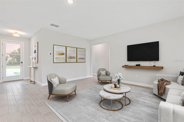 living room with light hardwood / wood-style flooring