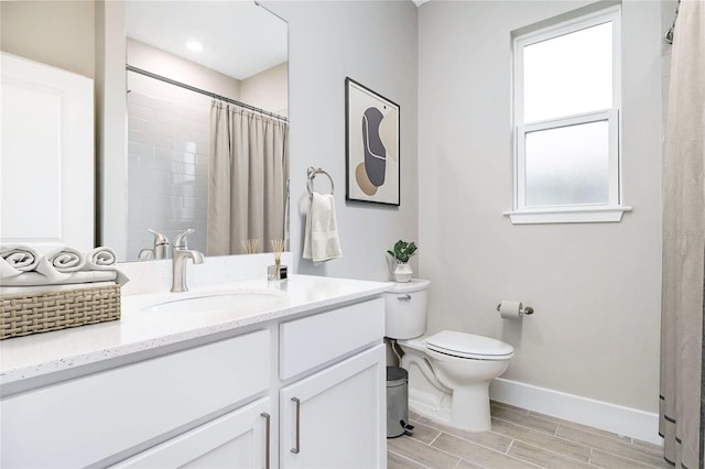 bathroom with toilet, a shower with shower curtain, and vanity