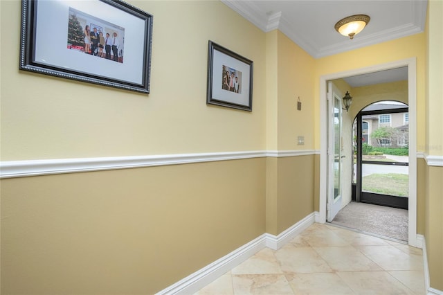 corridor featuring light colored carpet and ornamental molding