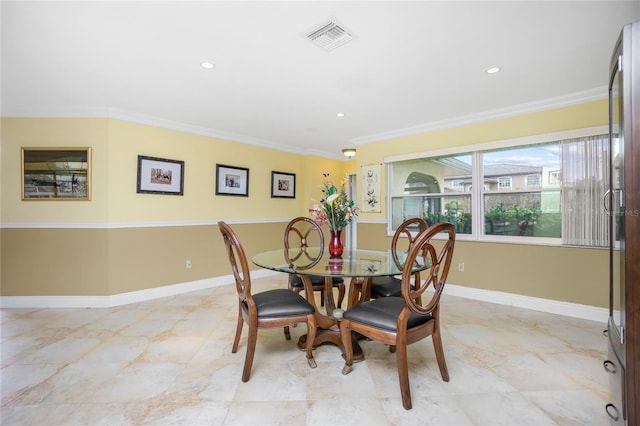 dining area with crown molding