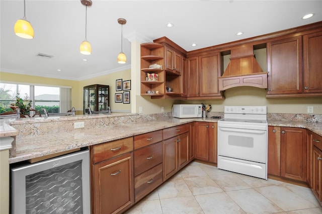 kitchen with decorative light fixtures, premium range hood, white appliances, ornamental molding, and beverage cooler