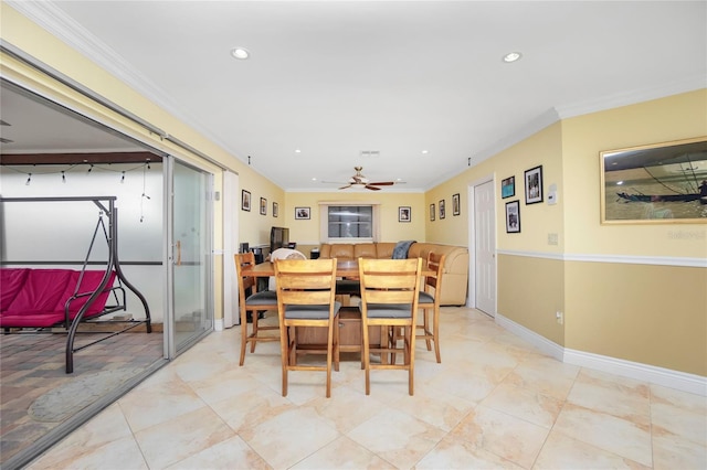 dining space featuring ceiling fan and crown molding