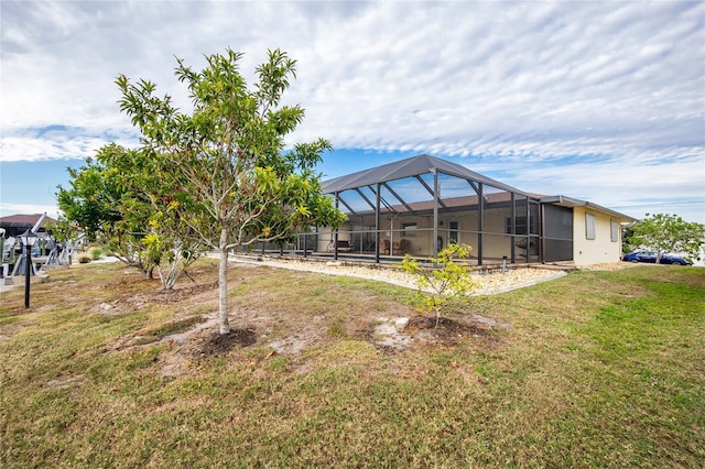 view of yard with glass enclosure