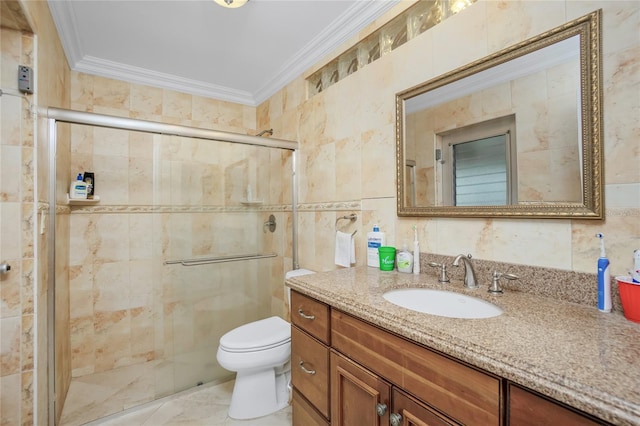 bathroom featuring toilet, vanity, tile walls, and crown molding