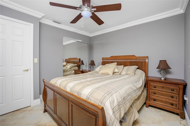 tiled bedroom with ceiling fan and ornamental molding