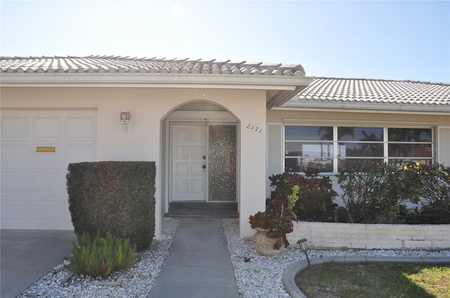 property entrance with a garage