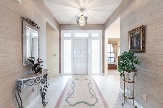 foyer entrance featuring light tile patterned floors