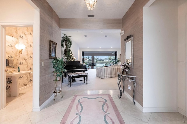 hallway featuring light tile patterned floors