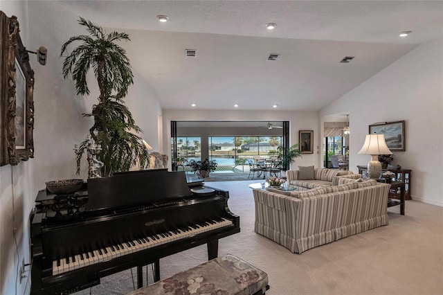 living room featuring light colored carpet and lofted ceiling