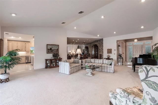 carpeted living room with vaulted ceiling