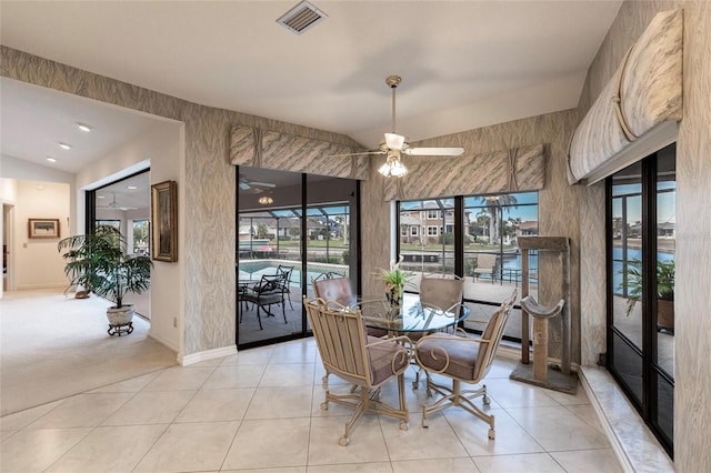 dining room featuring ceiling fan and light tile patterned flooring