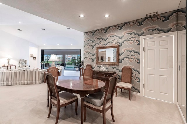 dining room with light colored carpet