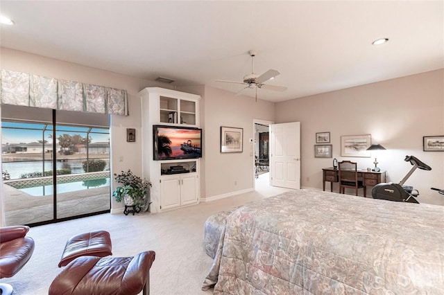 bedroom with access to outside, ceiling fan, a water view, and light colored carpet