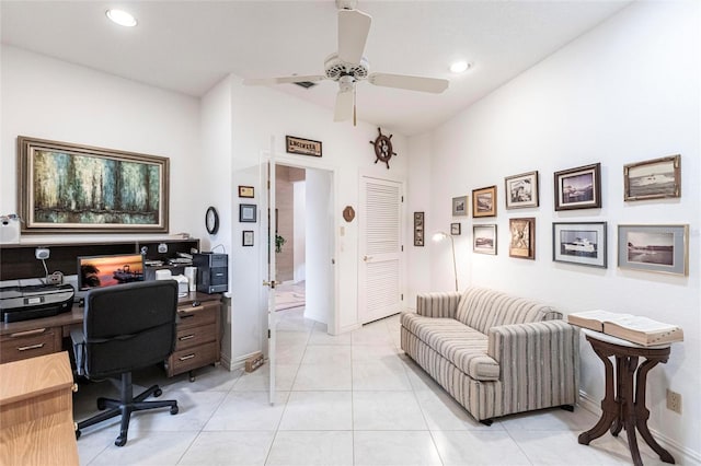 home office featuring ceiling fan and light tile patterned floors