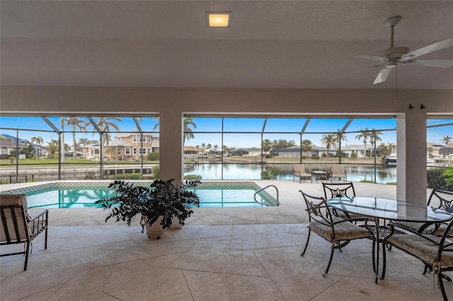 view of pool featuring a water view and ceiling fan