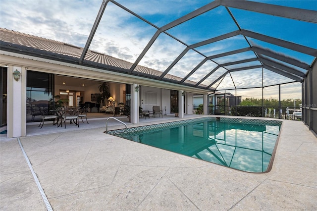 view of pool featuring a patio area and a lanai