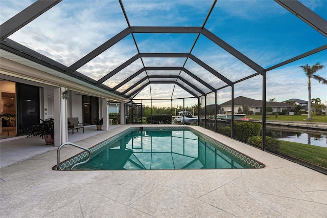 view of pool with a lanai and a patio area