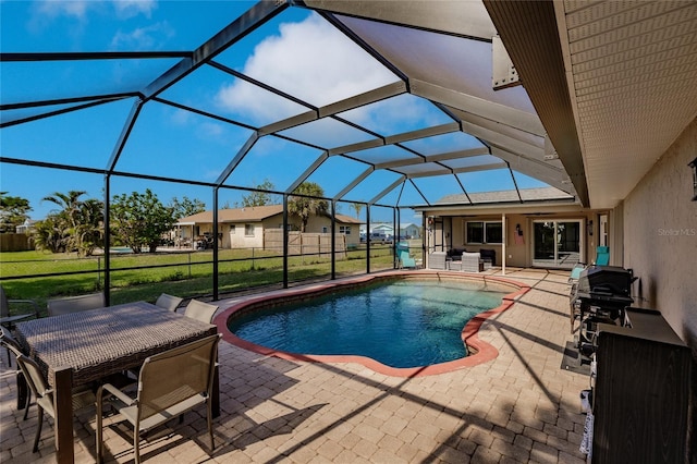 view of pool featuring a lanai, a patio area, and a yard