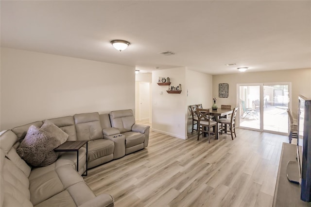 living room with light hardwood / wood-style flooring