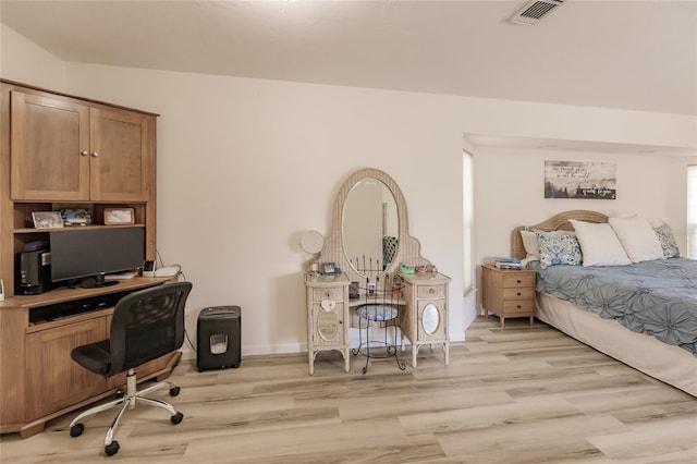 bedroom with light wood-type flooring