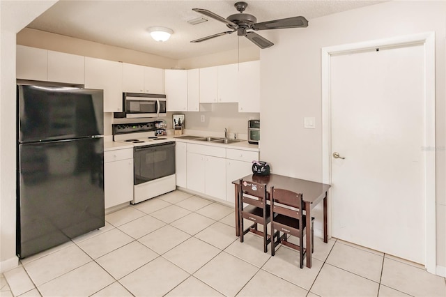 kitchen with white cabinetry, electric range, ceiling fan, sink, and black refrigerator