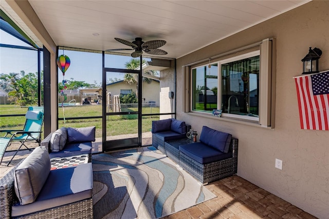 sunroom / solarium with ceiling fan