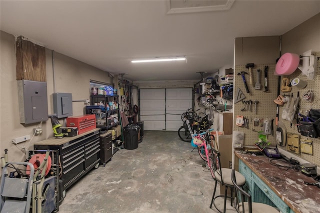 garage featuring a workshop area and electric panel