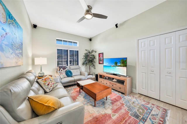 living room with ceiling fan and light hardwood / wood-style floors