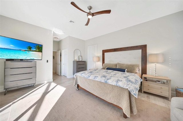 bedroom featuring ceiling fan and light wood-type flooring