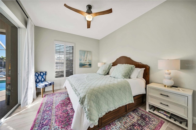 bedroom with access to exterior and ceiling fan