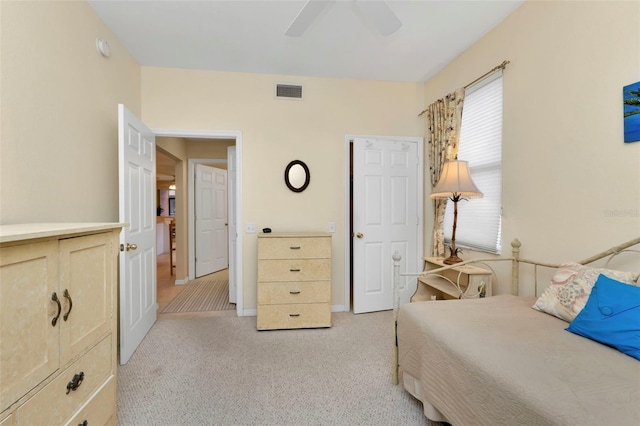 bedroom featuring ceiling fan and light carpet