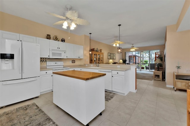 kitchen featuring kitchen peninsula, white appliances, white cabinetry, and sink